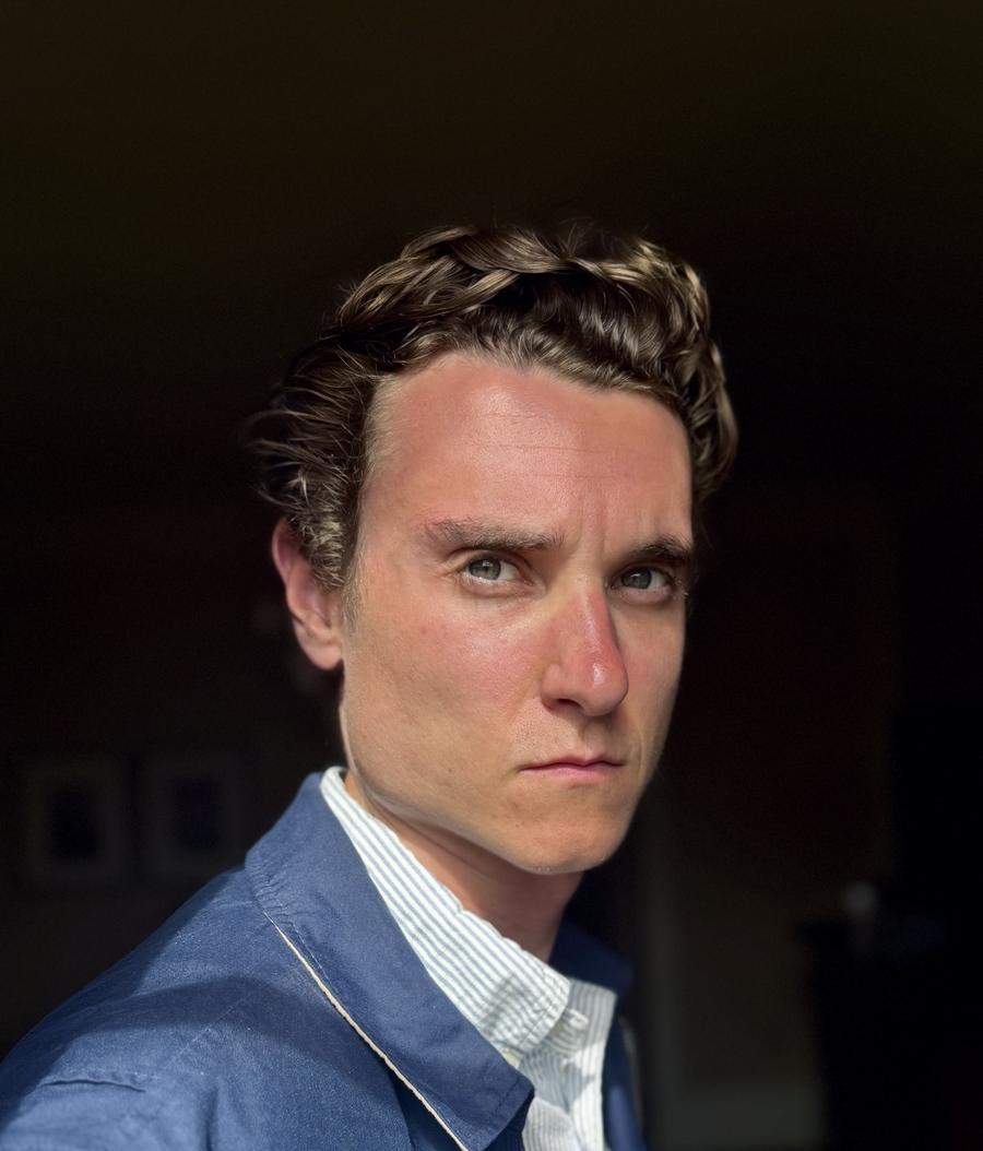 The candidate in a stern portrait, dramatic side lighting